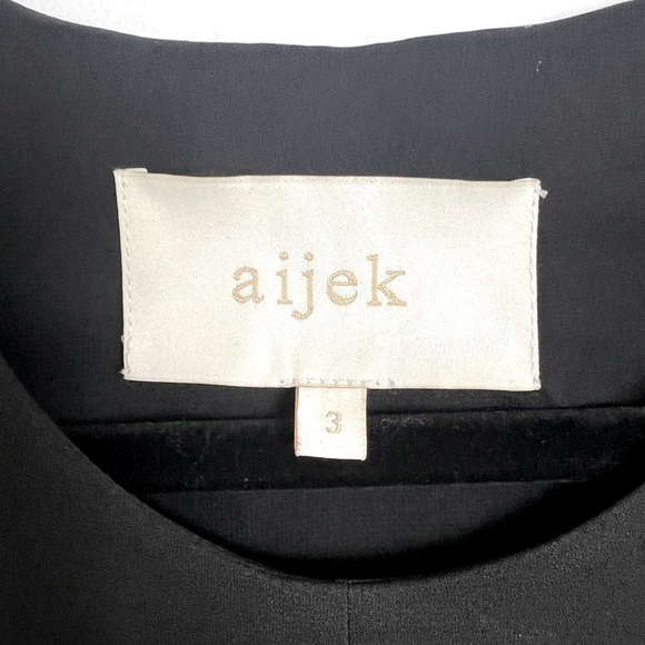 Aijek Black Minimalist Sheer Panel Sleeveless Hi-Lo Hem Knee Length Shift Dress - Picture 11 of 13